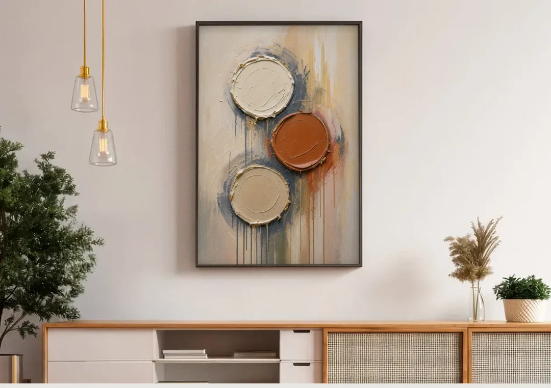 3D Textured Terracotta Disc Trio canvas wall art above a wooden sideboard under pendant lights