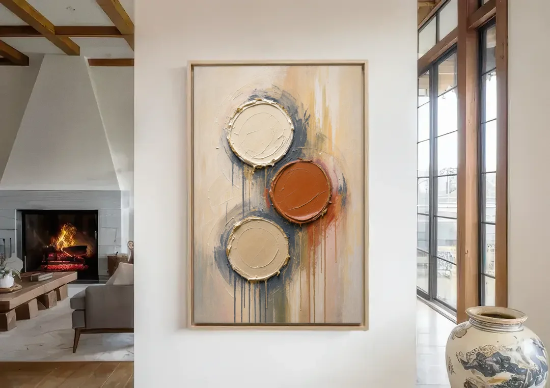 3D Textured Terracotta Disc Trio canvas wall art in a living room with a fireplace