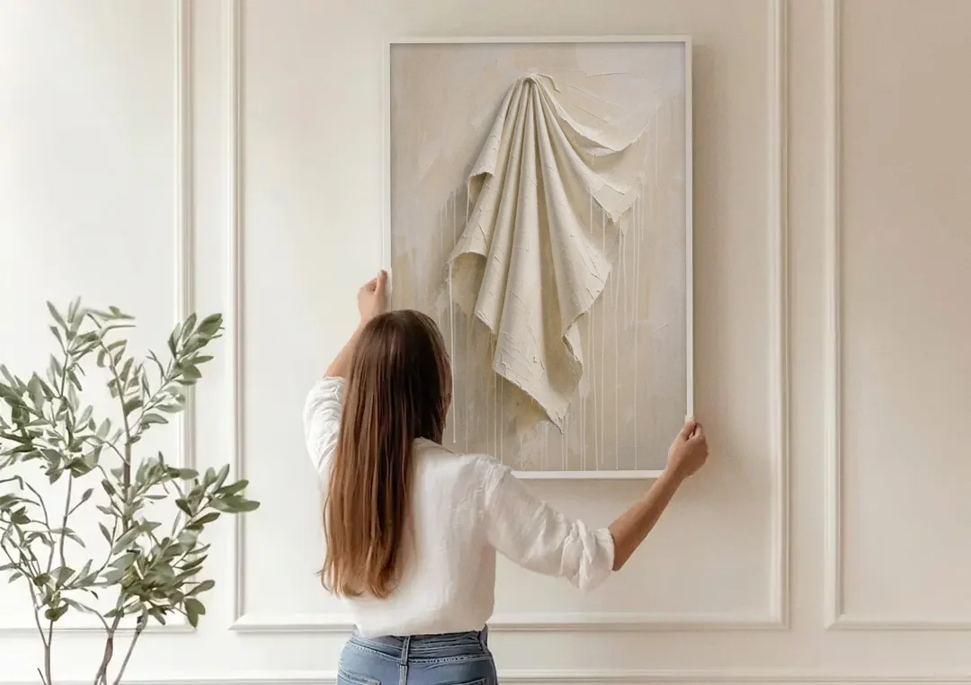 3D White Wall Art of Draped Plaster Cloth canvas wall art being hung on a paneled wall