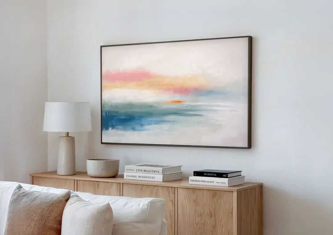 Abstract Art Above Bed with Tangerine Haze canvas wall art above a wooden sideboard next to a sofa