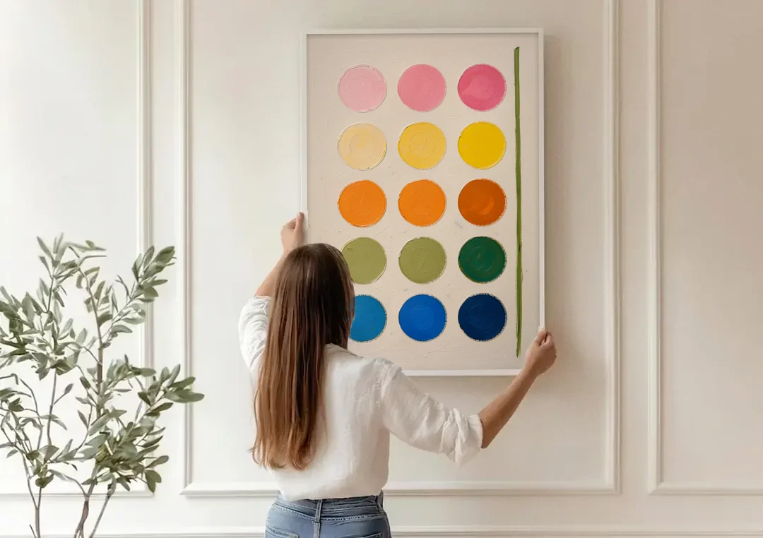 Abstract Art for Bedroom with Fading Painted Circles canvas wall art being hung on a paneled wall