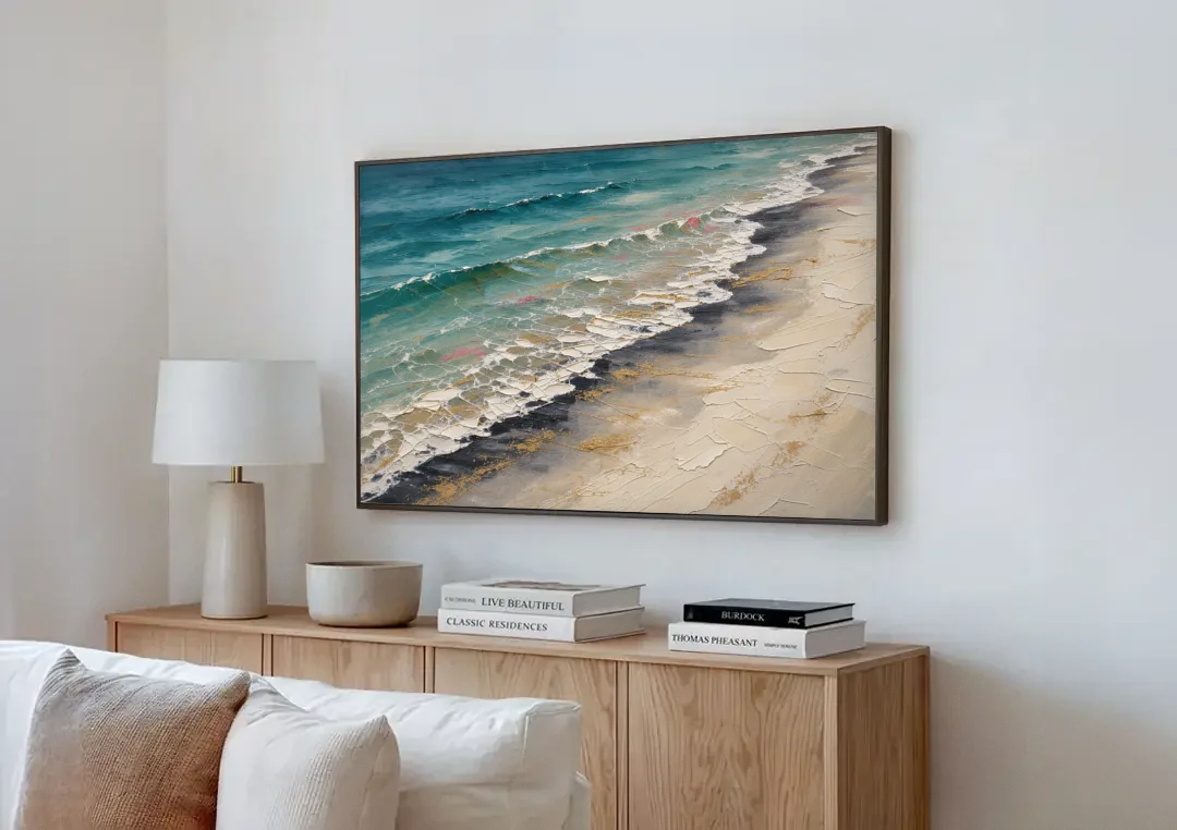 Abstract Beach Painting with Gold Foam Lines canvas wall art above a wooden sideboard next to a sofa