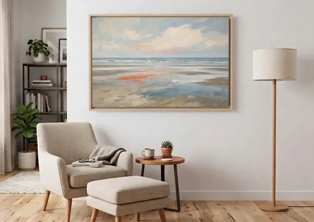 Abstract Beach Wall Art of Coral Tidal Flats canvas wall art above an armchair in a bright living room