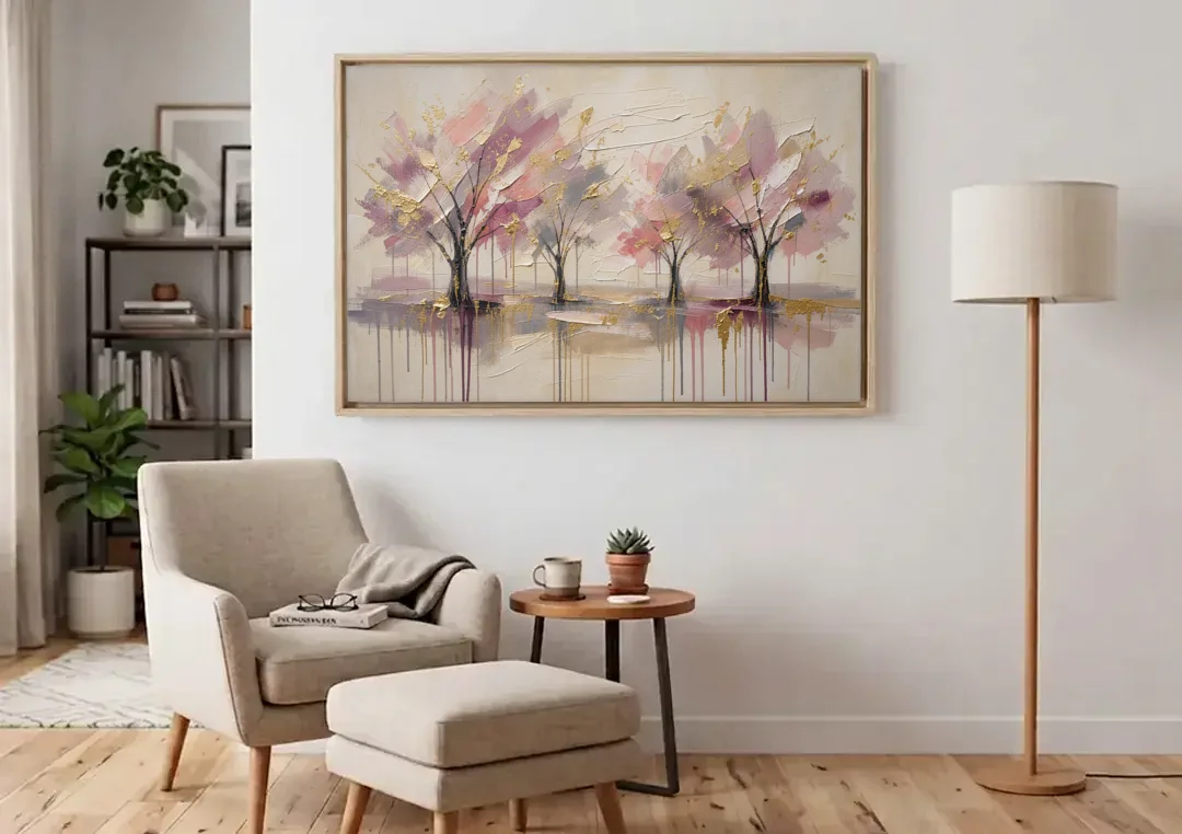 Abstract Cherry Blossom Painting with Gold Drips canvas wall art above an armchair in a bright living room