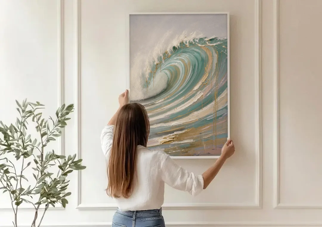 Abstract Coastal Wall Art of a Gilded Curling Wave canvas wall art being hung on a paneled wall