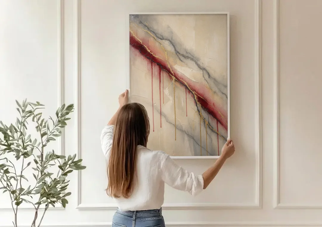 Abstract Crimson Vein in Cream Marble canvas wall art being hung on a paneled wall