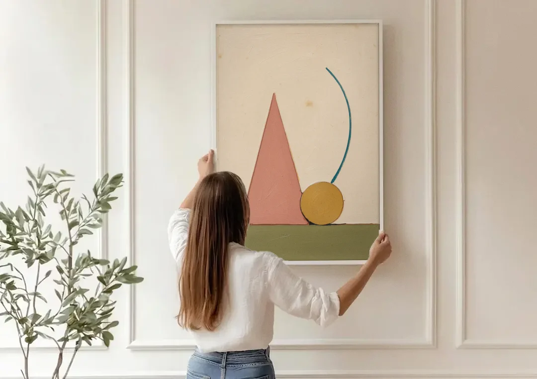 Abstract Geometric Wall Art of a Circle at Rest canvas wall art being hung on a paneled wall