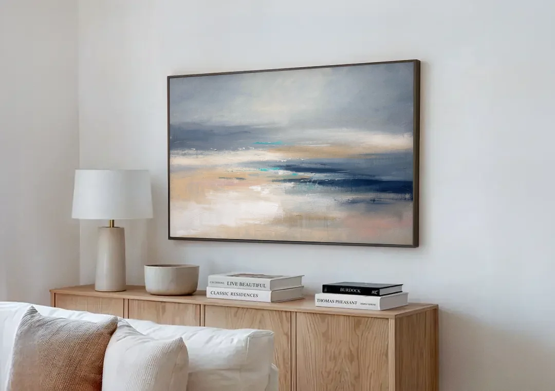 Abstract Horizon Painting in Navy and Mist canvas wall art above a wooden sideboard next to a sofa