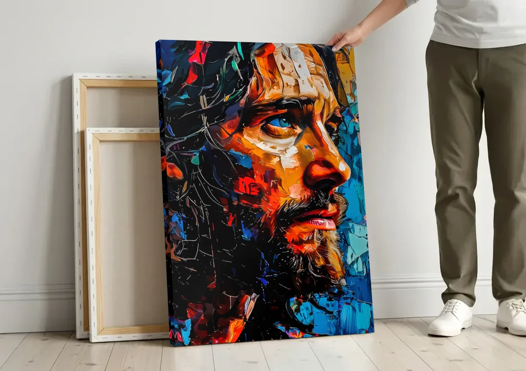 Abstract Jesus Portrait canvas wall art leaning against a wall next to blank canvases