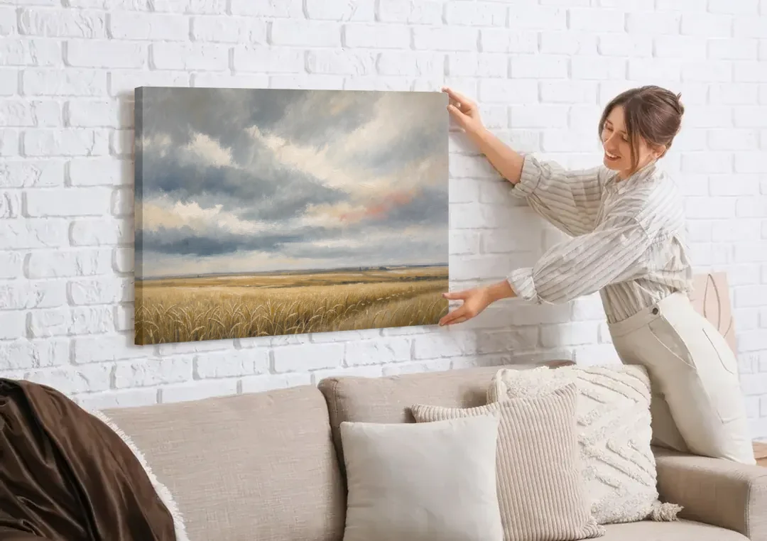 Abstract Landscape Canvas Art of the Open Prairie canvas wall art being hung on a white brick wall above a sofa