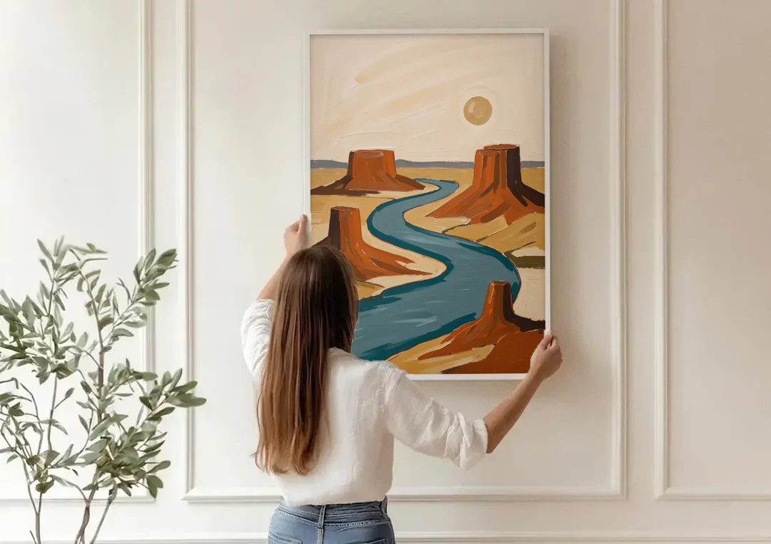 Abstract Landscape Painting of a River and Mesas canvas wall art being hung on a paneled wall