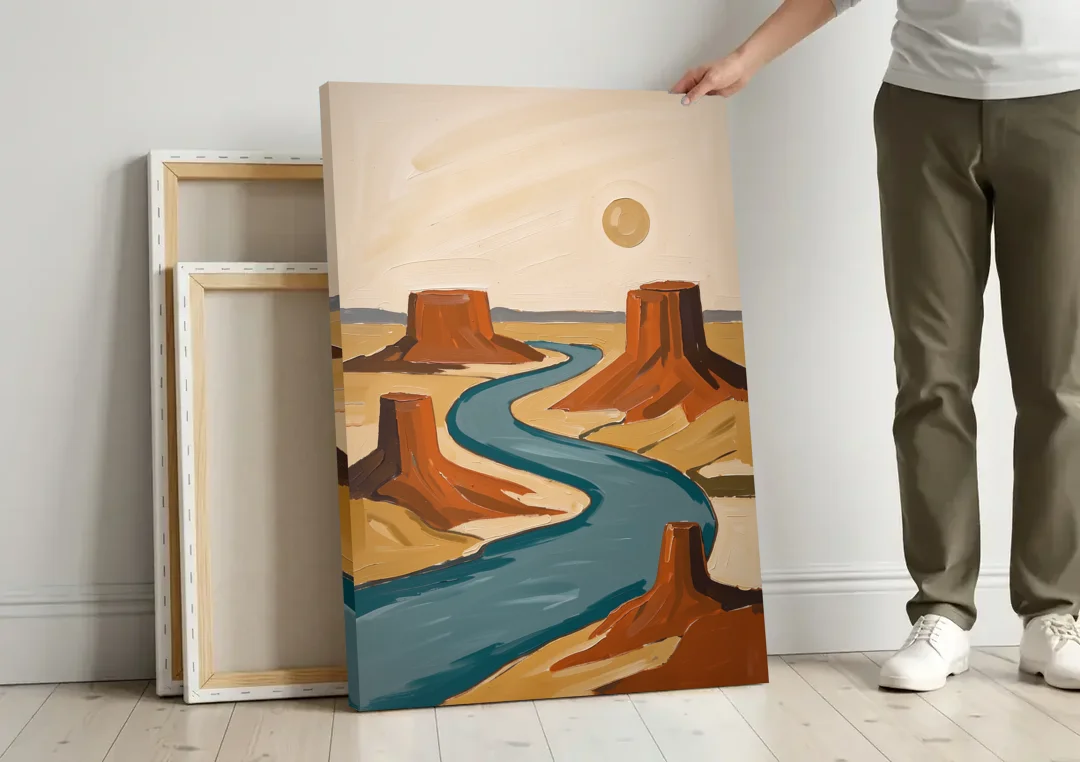 Abstract Landscape Painting of a River and Mesas canvas wall art leaning against a wall next to blank canvases