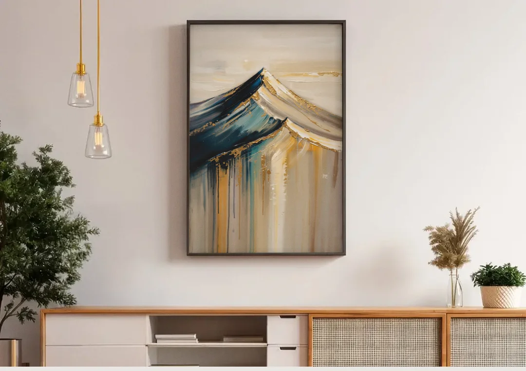 Abstract Mountain Painting with Gold Ridgelines canvas wall art above a wooden sideboard under pendant lights