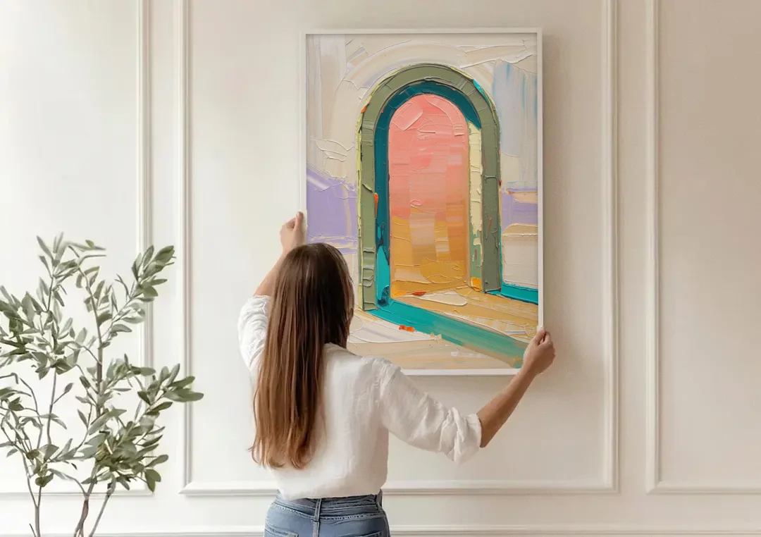 Abstract Sage Green Arch with Peach Glow canvas wall art being hung on a paneled wall