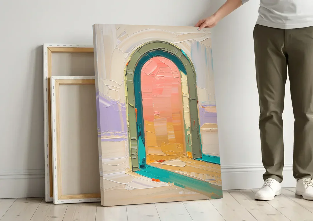 Abstract Sage Green Arch with Peach Glow canvas wall art leaning against a wall next to blank canvases