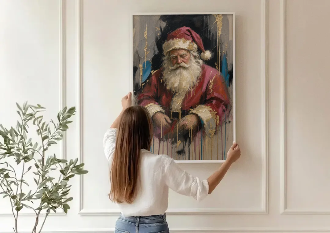 Abstract Santa Painting with Gold Drips canvas wall art being hung on a paneled wall