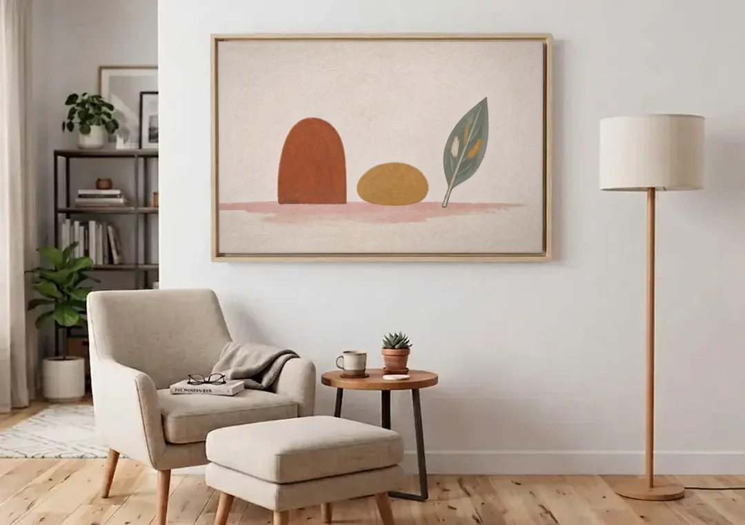Abstract Shapes Wall Art with Arch, Pebble and Leaf canvas wall art above an armchair in a bright living room