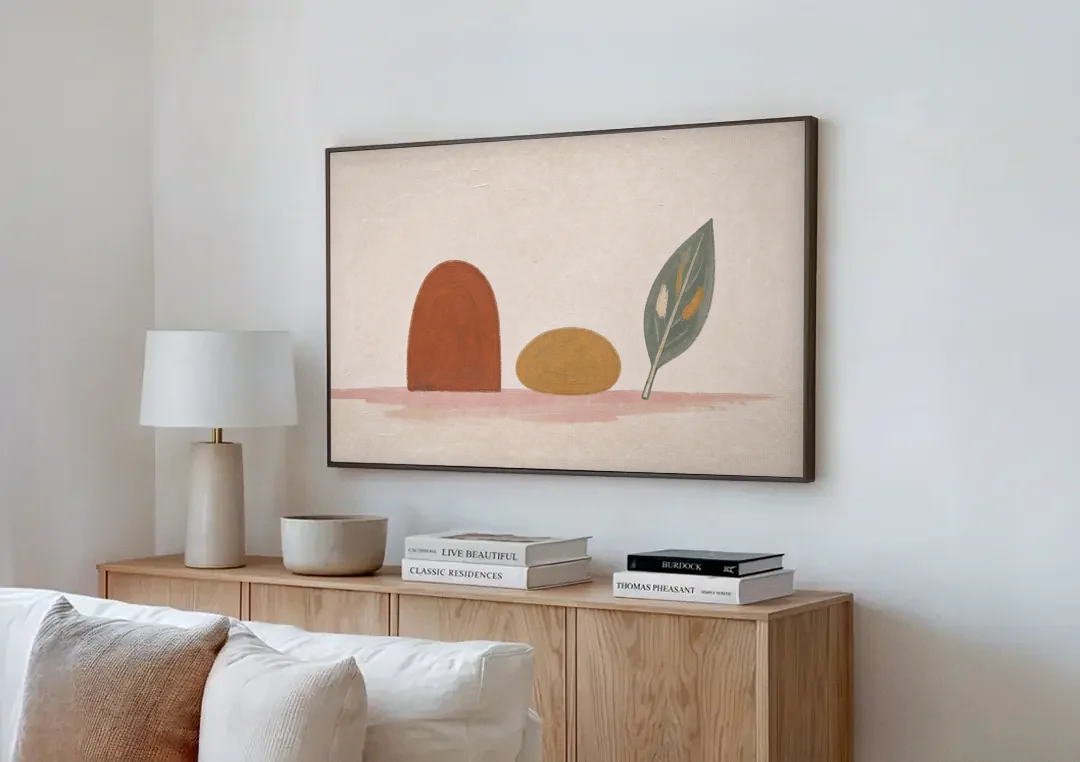 Abstract Shapes Wall Art with Arch, Pebble and Leaf canvas wall art above a wooden sideboard next to a sofa