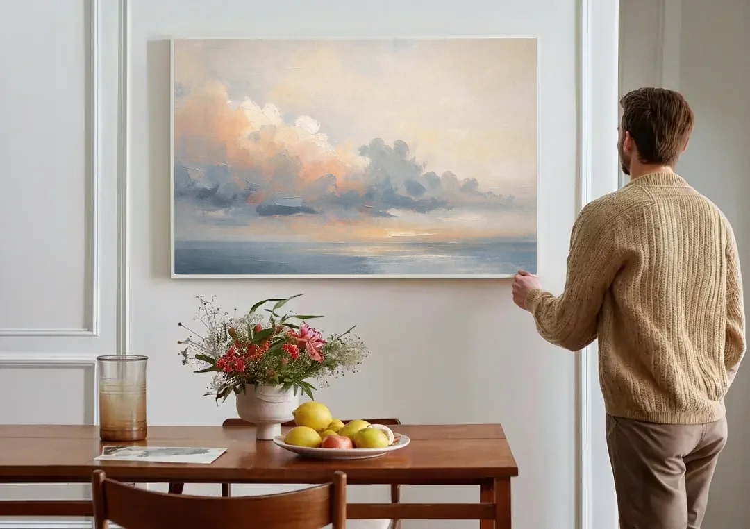 Abstract Sky Painting with Peach Cloud Bank canvas wall art above a dining table