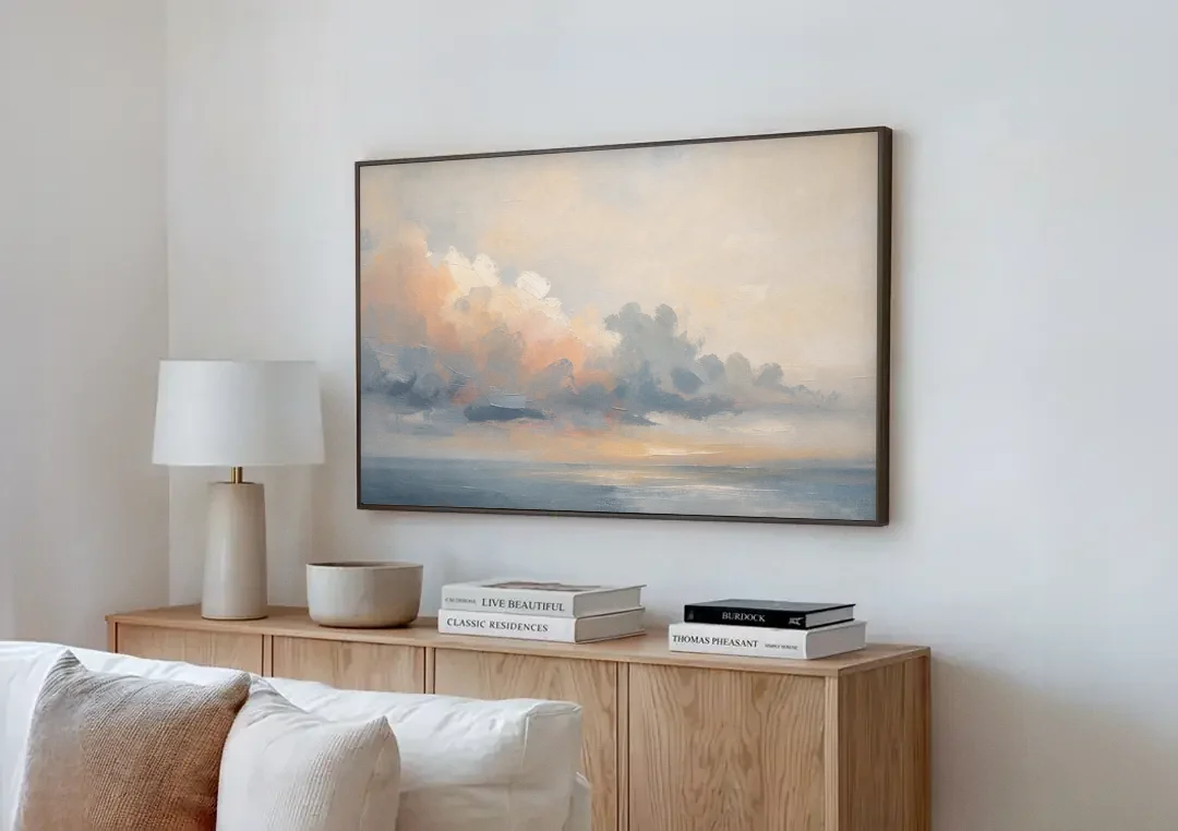 Abstract Sky Painting with Peach Cloud Bank canvas wall art above a wooden sideboard next to a sofa