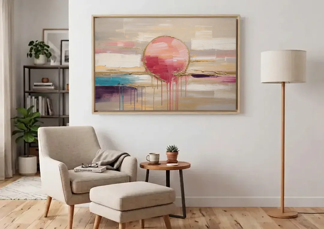 Abstract Sun Painting with Gold Drips canvas wall art above an armchair in a bright living room