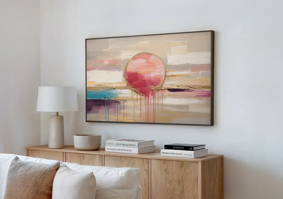 Abstract Sun Painting with Gold Drips canvas wall art above a wooden sideboard next to a sofa