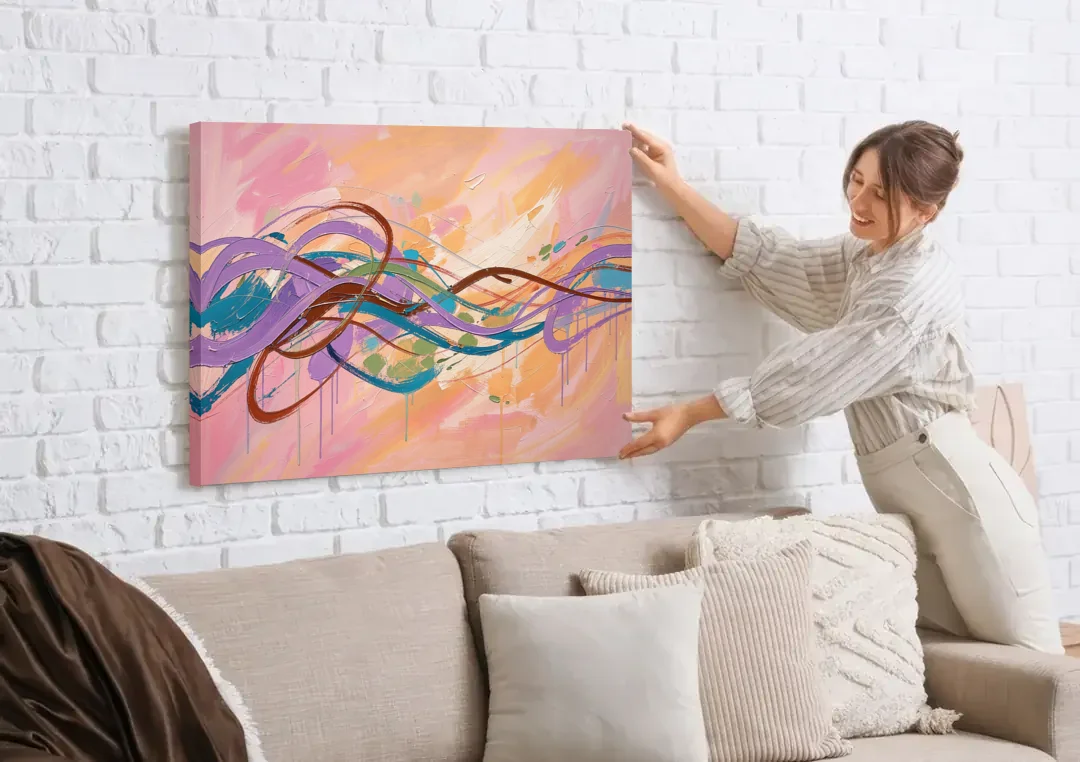 Abstract Wall Art for Bedroom Lavender Ribbon Loops canvas wall art being hung on a white brick wall above a sofa