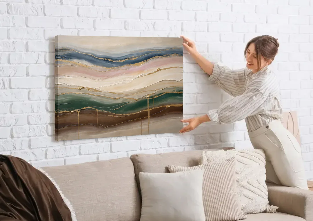Agate Bands in Forest Green and Gold canvas wall art being hung on a white brick wall above a sofa