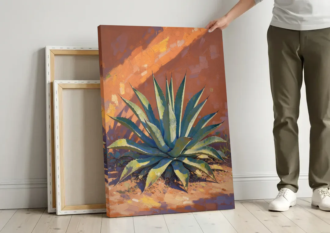 Agave Painting Against a Sunlit Adobe Wall canvas wall art leaning against a wall next to blank canvases