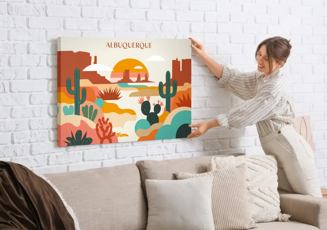 Albuquerque Southwest Colors canvas wall art being hung on a white brick wall above a sofa