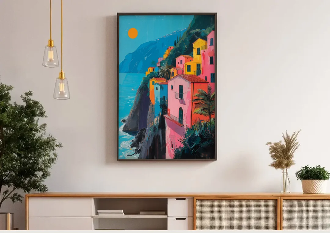 Amalfi Painting of Pink Cliff Houses canvas wall art above a wooden sideboard under pendant lights
