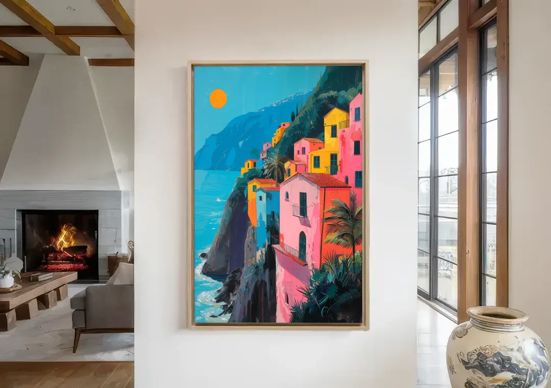 Amalfi Painting of Pink Cliff Houses canvas wall art in a living room with a fireplace