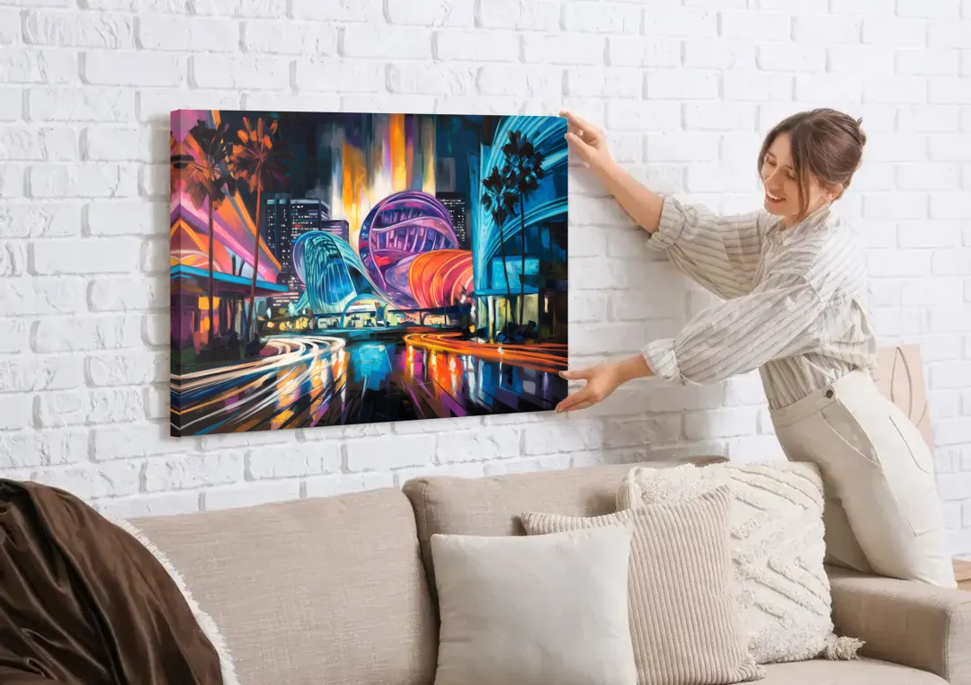 Anaheim Downtown Glow canvas wall art being hung on a white brick wall above a sofa