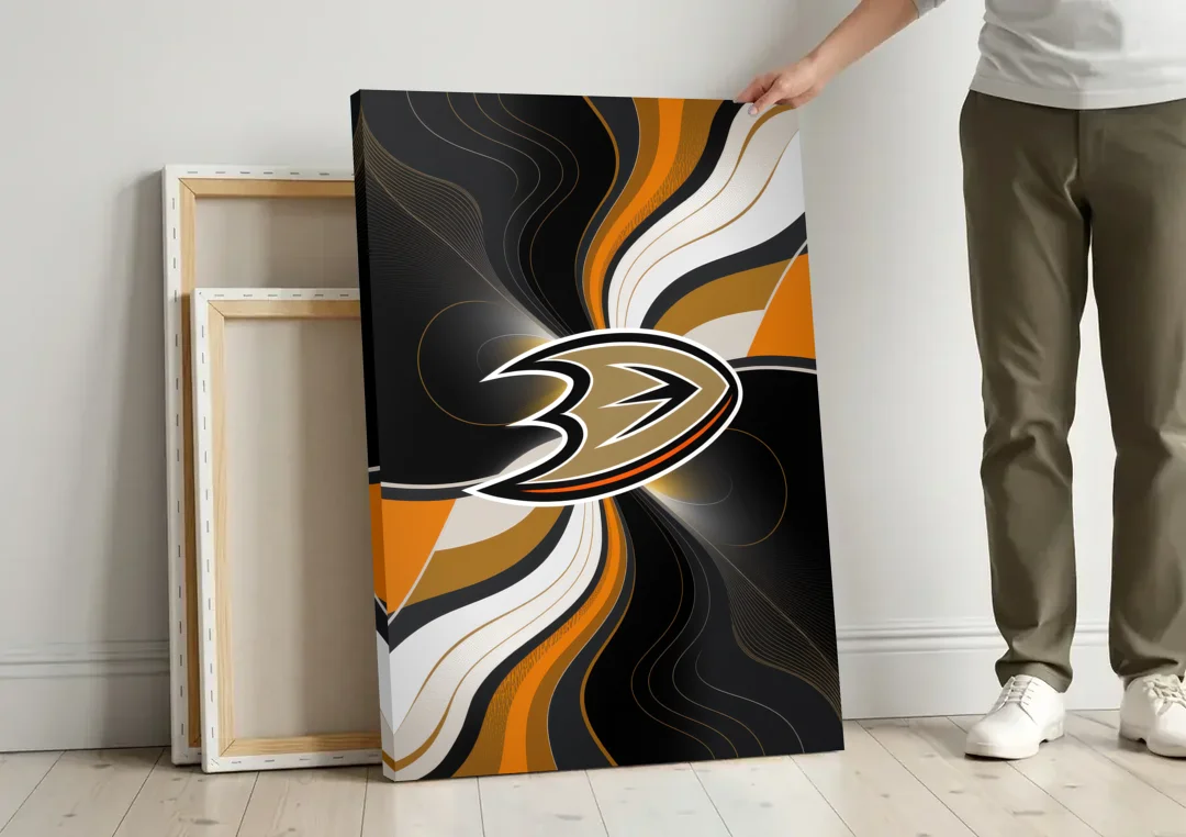 Anaheim Ducks Pride canvas wall art leaning against a wall next to blank canvases