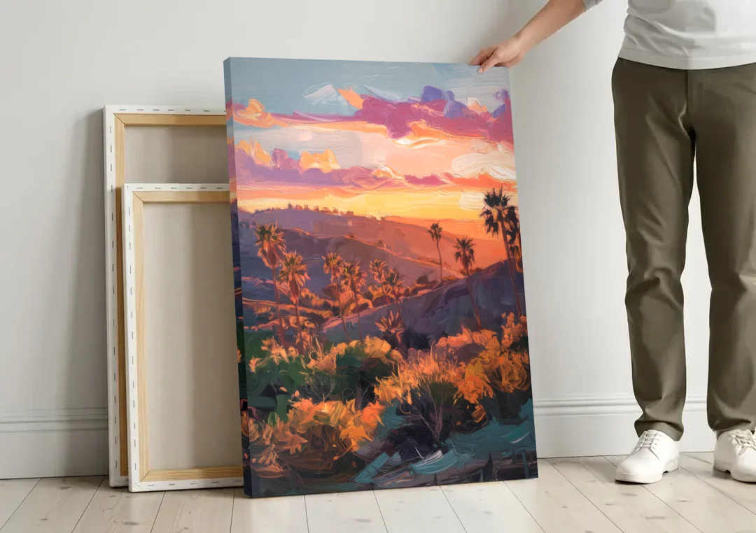 Anaheim Sunset Views canvas wall art leaning against a wall next to blank canvases