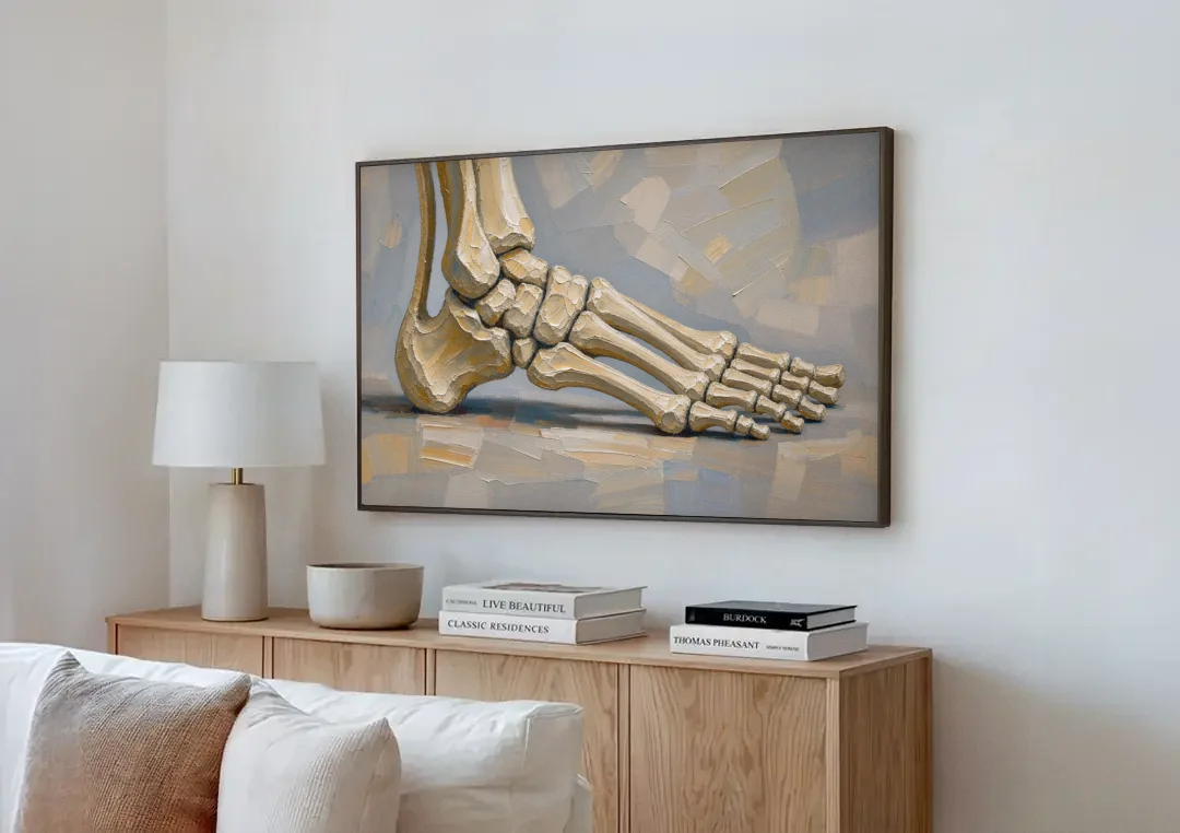 Anatomy Wall Art of the Arching Foot canvas wall art above a wooden sideboard next to a sofa