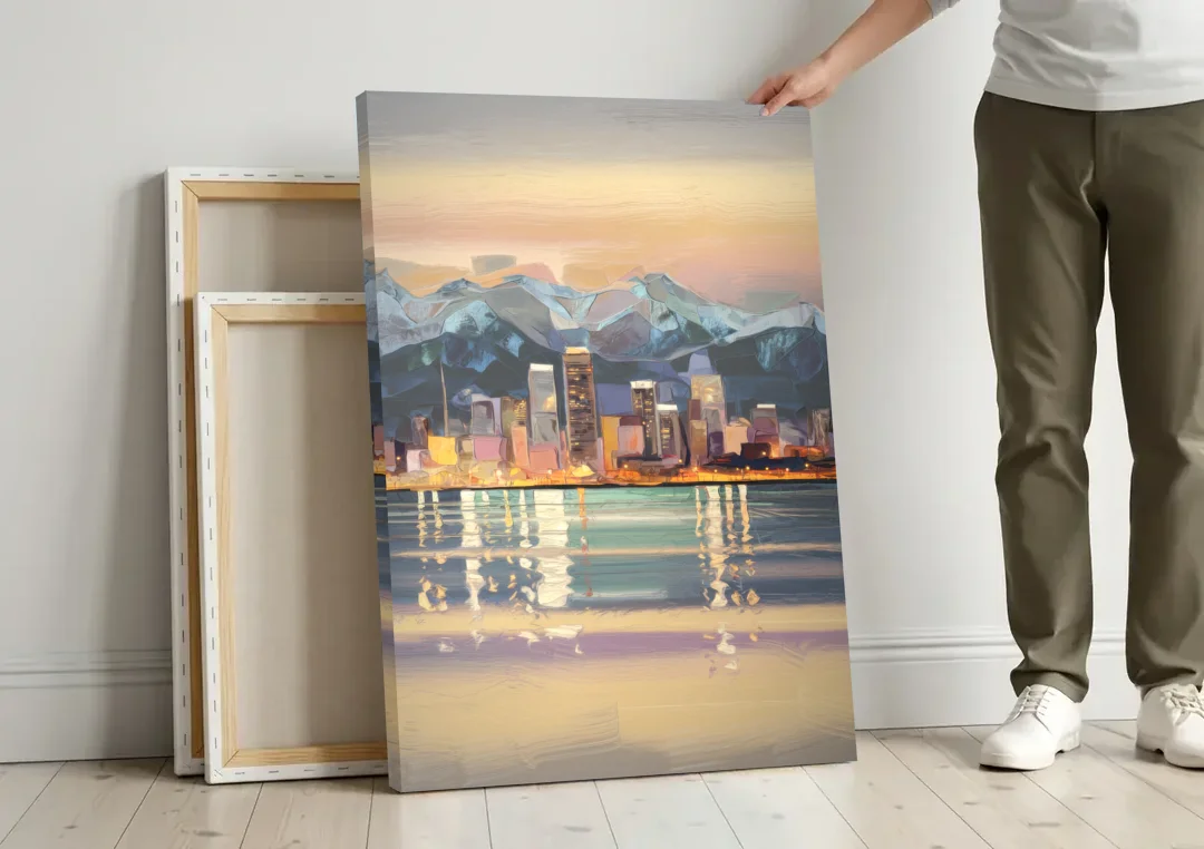 Anchorage Cityscape Reflection canvas wall art leaning against a wall next to blank canvases