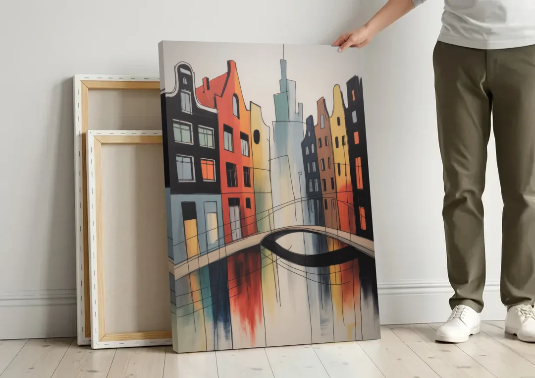 Anne Frank's Amsterdam canvas wall art leaning against a wall next to blank canvases