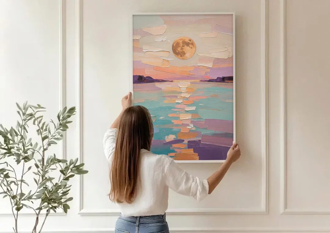 Apricot Moon Over a Teal Lagoon canvas wall art being hung on a paneled wall