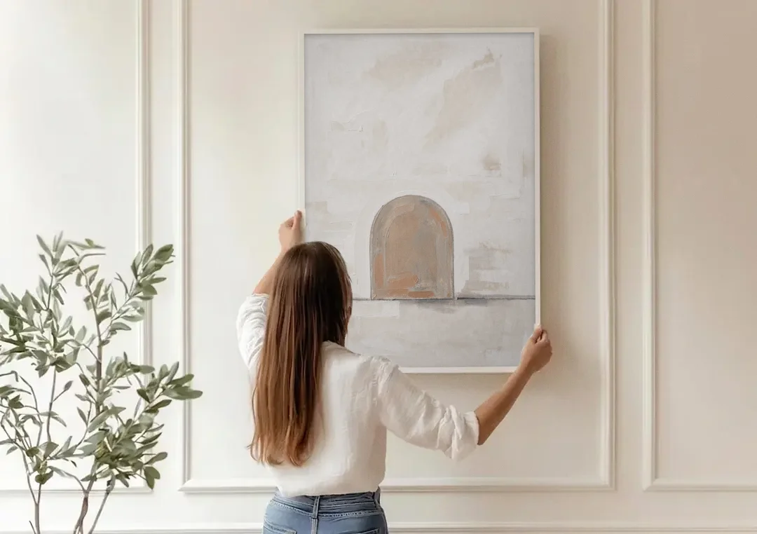 Arch Wall Art of a Brick Dust Niche canvas wall art being hung on a paneled wall
