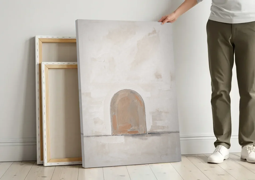 Arch Wall Art of a Brick Dust Niche canvas wall art leaning against a wall next to blank canvases