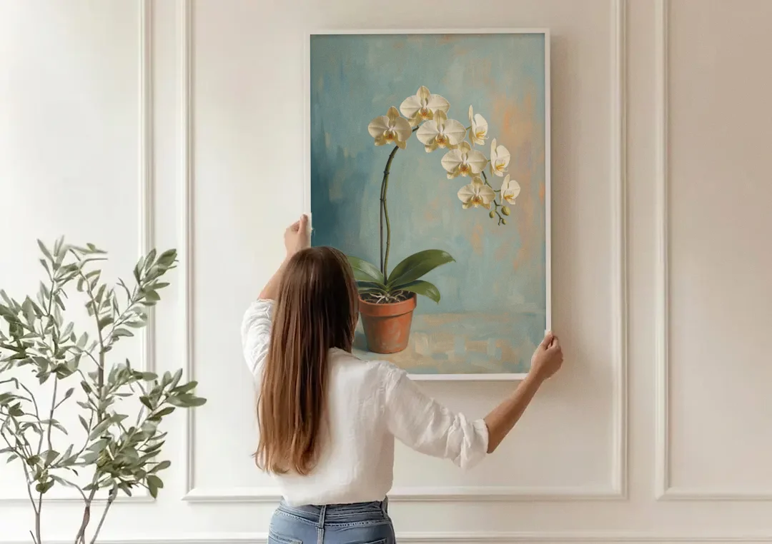 Arching White Moth Orchid Flower canvas wall art being hung on a paneled wall