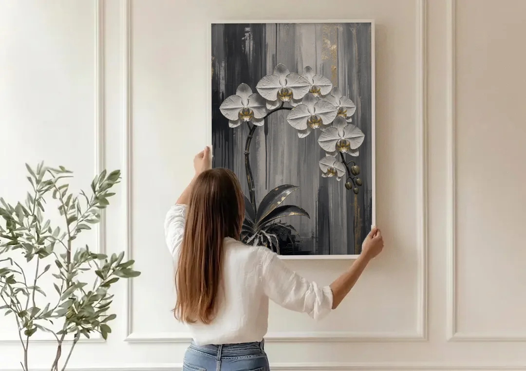 Arching White Orchid Spray with Gold Accents canvas wall art being hung on a paneled wall