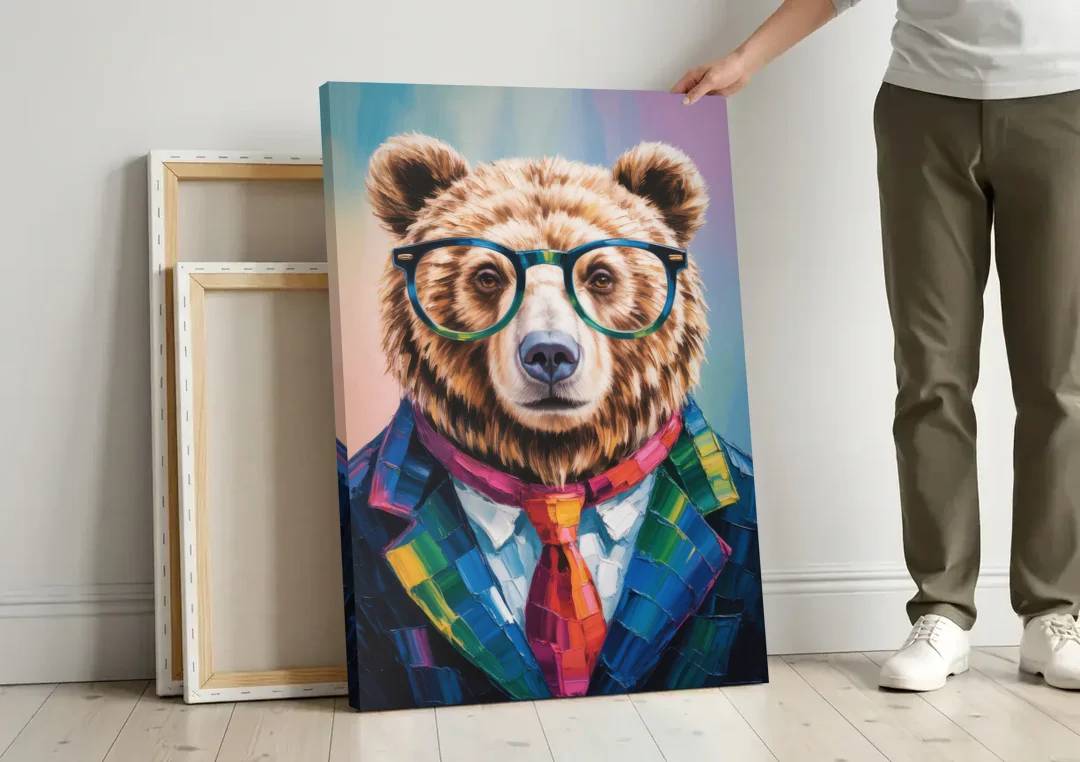 Artistic Bear with Glasses canvas wall art leaning against a wall next to blank canvases