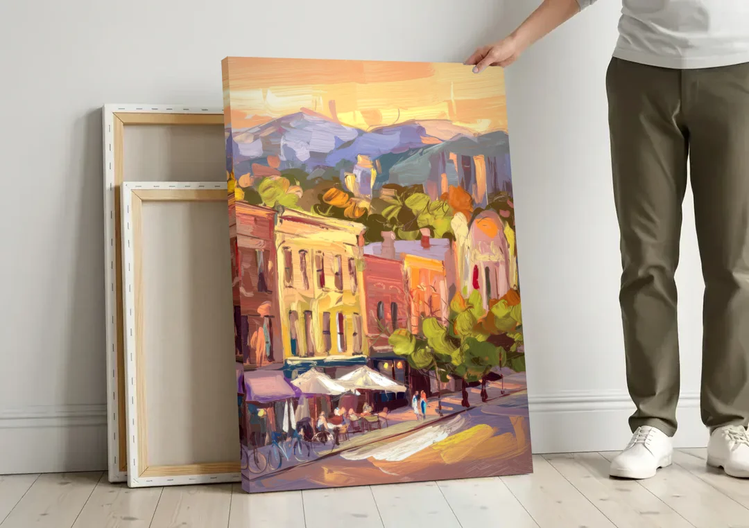 Asheville Downtown Landmarks canvas wall art leaning against a wall next to blank canvases