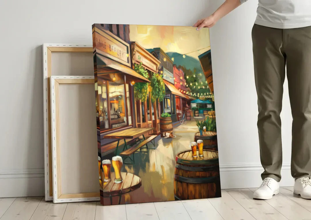 Asheville Local Brewery District canvas wall art leaning against a wall next to blank canvases