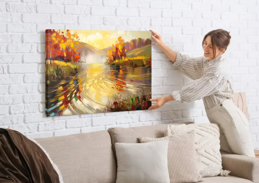 Asheville Riverfront Serenity canvas wall art being hung on a white brick wall above a sofa