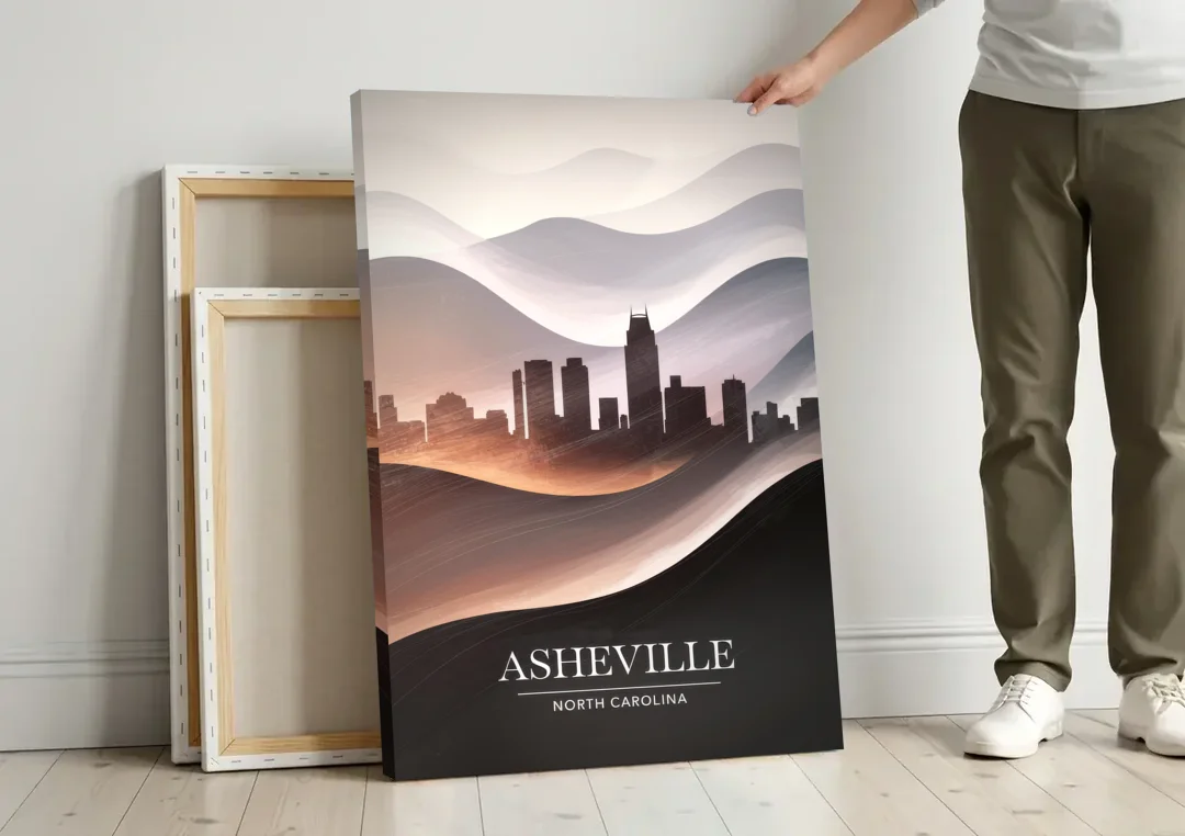 Asheville Skyline and Mountains canvas wall art leaning against a wall next to blank canvases