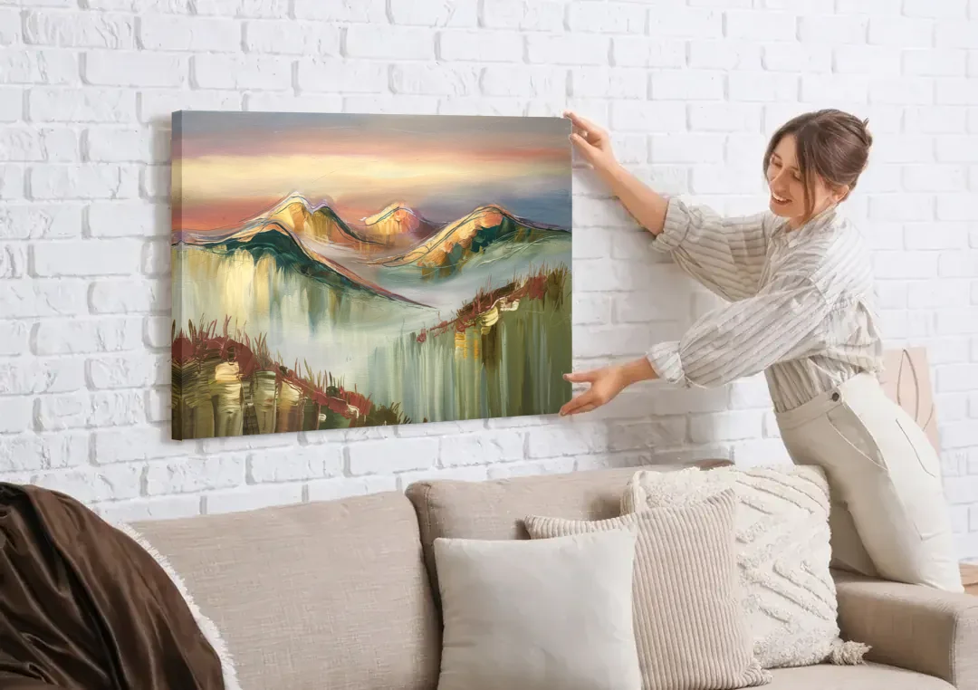 Ashland Mountain View canvas wall art being hung on a white brick wall above a sofa
