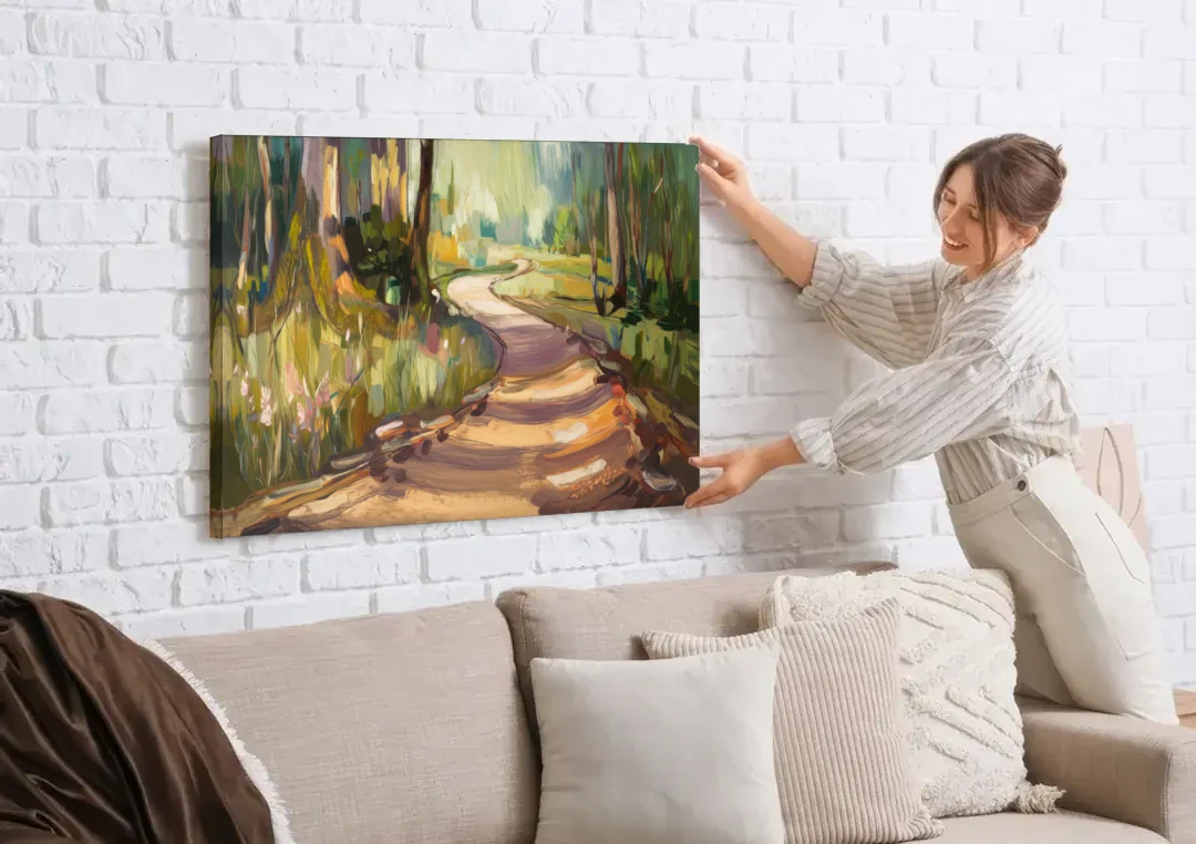 Ashland Scenic Trails canvas wall art being hung on a white brick wall above a sofa